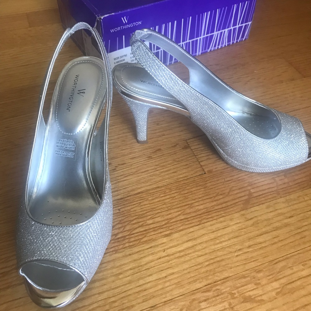 Open-toe silver sling-back heels.